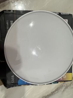 Tuya sky-BK Smart Ceiling Lamp Tuya sky-BK smart ceiling lamp resting on a box.