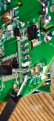 Close-up of electronics on a green PCB board.