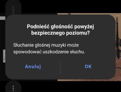 Komunikat ostrzegający o podniesieniu głośności powyżej bezpiecznego poziomu na ekranie smartfona.