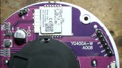 Circuit board with electronic components on a purple background.