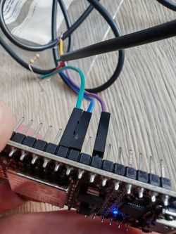 Wiring Connections to NodeMCU v2 Close-up of a NodeMCU v2 board with female jumper wires connected.