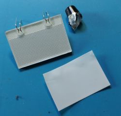 Backlight panel from a trash bin with a trimmed paper sheet and a diode.