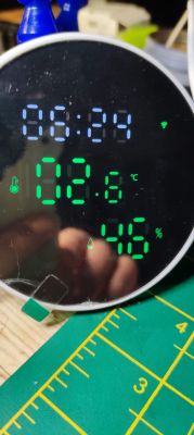 Digital display showing time, temperature, and humidity.