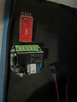 Relay module with FTDI232 adapter and wires Electronic relay module, FTDI232 adapter, and wires with connectors.