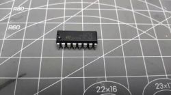 L293D Integrated Circuit on Measurement Mat L293D integrated circuit on a measurement mat with a visible grid.