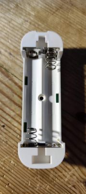 Battery Compartment of Electronic Device Battery compartment of an electronic device with visible spring contacts.