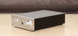 Headphone Amplifier in a Metal Enclosure Metal enclosure of a headphone amplifier with a volume knob and headphone jack.