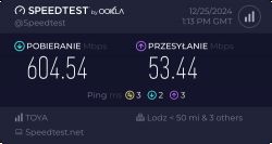 Wynik testu prędkości internetu pokazujący pobieranie 604.54 Mbps i wysyłanie 53.44 Mbps.