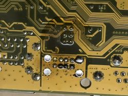 Close-up of a circuit board with visible traces and soldering points.