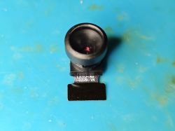 GalaxyCore GC0329 camera module on a blue surface