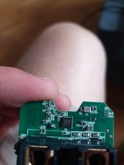 Mainboard of a smart plug with visible components.