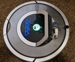 Roomba with WiFi Module Roomba vacuum with attached WiFi module