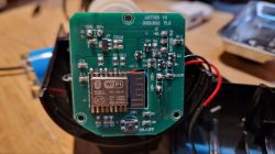 Circuit Board with Wi-Fi Module in Fish Feeder Close-up of a circuit board with an XT-BL12 Wi-Fi module in an automatic fish feeder.