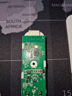 Close-up of a PCB featuring the BK7231N chip and electronic components.