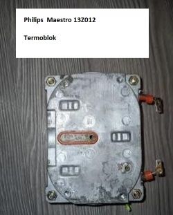 Termoblok ekspresu do kawy Philips Maestro 13Z012 leżący na drewnianej powierzchni.