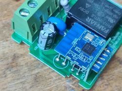 Interior of Smart Switch Relay with CB2S Module Image of the interior of a smart switch relay with a CB2S module on the circuit board.