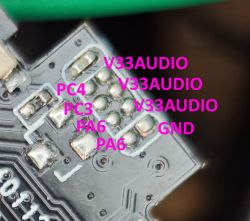 Signal headers on a PCB with labeled pins Close-up of PCB with labeled pins: PC4, PC3, PA6, GND, and V33AUDIO