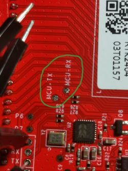 Close-up of a circuit board with marked UART points.