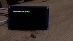 OLED display showing blue text 1234567890 -- ABCDEFGH.