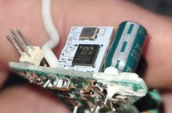 Close-up of BK7231N Chip on Circuit Board Close-up of a circuit board with a BK7231N chip and a capacitor visible.