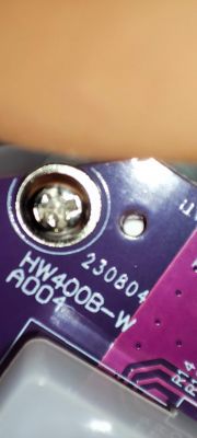 Close-up of a printed circuit board with HW400B-W A004 marking.