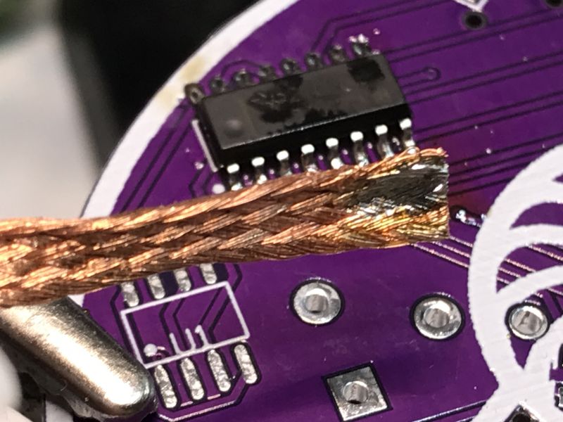 Soldering an Integrated Circuit on a PCB PCB with a soldered IC and braid for removing excess solder.