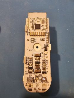 AUBESS Door Sensor PCB ready for flashing Door sensor PCB with electronic components and visible header pins for wire connection.