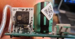 Close-up of an LED circuit board with a chip and capacitor.