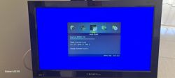 The image shows a CROWN brand TV with a blue screen displaying a channel scanning interface.