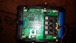 Close-up of a circuit board with a battery.