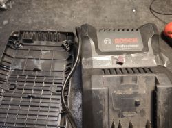 Bosch Professional GAL 18V-40 charger with open case cover.