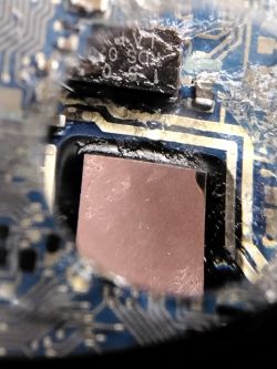 Burnt electronic component on a circuit board.
