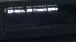 Black OLED screen displaying the white text ESP-Radio, OTA Firmware Update.