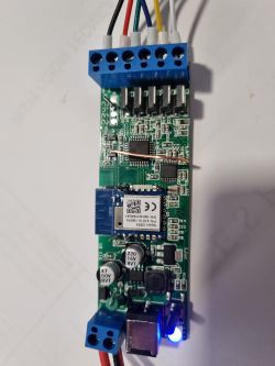 Electronic board with connected wires and Tuya module.
