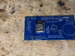 PCB board with ESP8266 module and labeled connectors.
