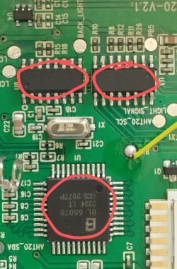 Close-up of a PCB with three integrated circuits, two with unreadable markings and one marked BL 55070.