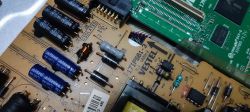 Close-up of a motherboard with electronic components labeled Vestel 17IPS61-3.