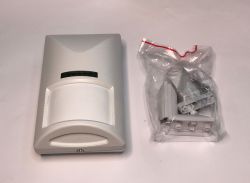 PIR motion detector and a set of mounting accessories in a plastic bag.