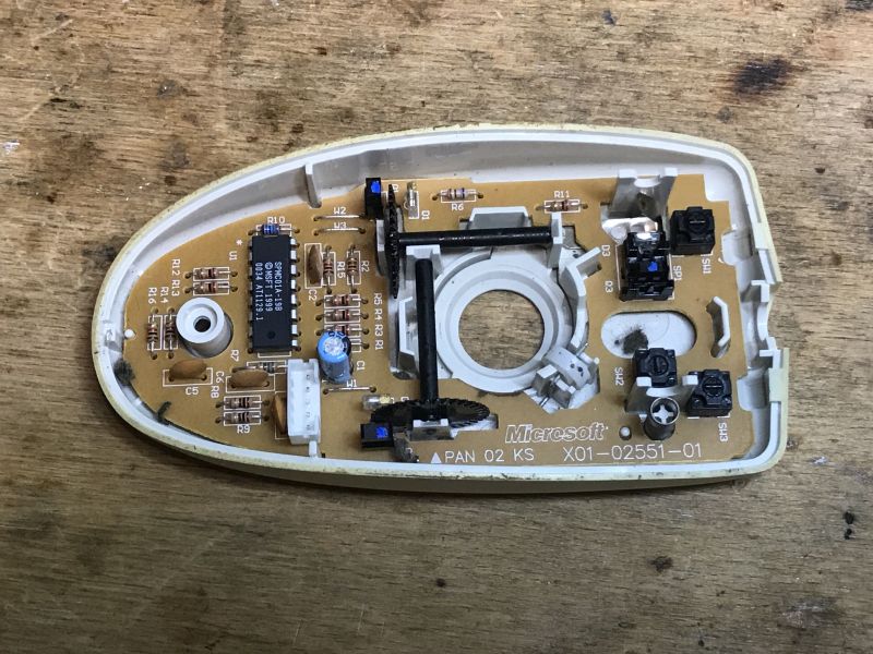 Interior of a Ball Mouse Interior of an old ball mouse showing visible electronic components.