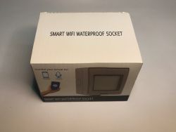 White box labeled SMART WIFI WATERPROOF SOCKET showing a WiFi-controlled outdoor electrical socket.
