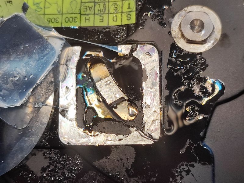Flooded Hard Drive with Corrosion Flooded hard drive with visible water and corrosion traces.