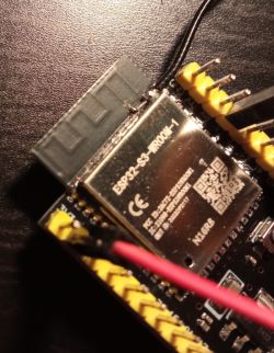 Close-up of ESP32-S3 board with an externally soldered antenna.
