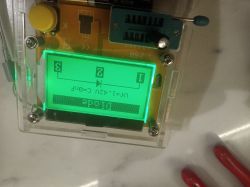 Electronic tester display showing diode measurement results.