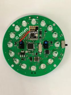 Okrągła płytka PCB z elementami elektronicznymi, w tym ATmega328 TQFP i modułem RF.