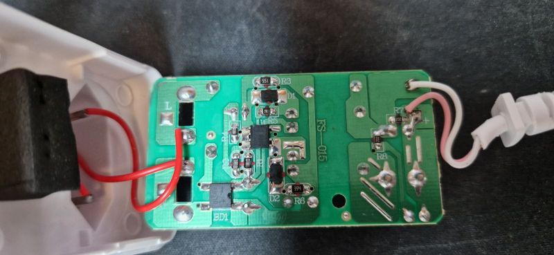 Image of the inside of an electronic module with visible components.
