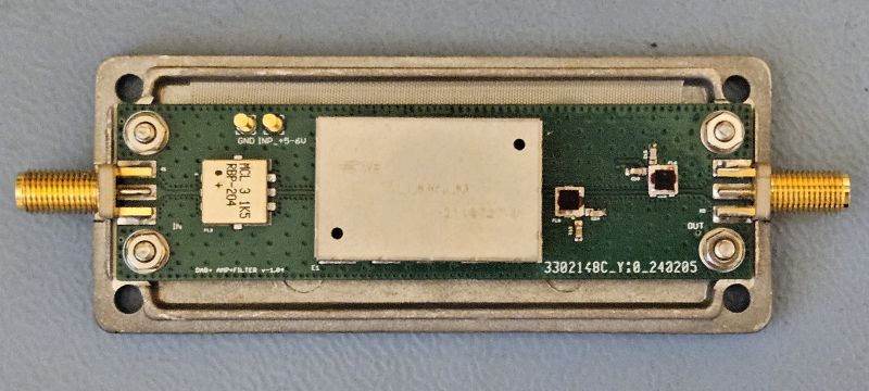DAB+ Amplifier on Circuit Board DAB+ amplifier mounted on a green circuit board in a metal case.
