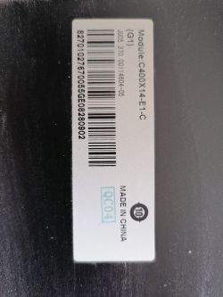 Label with TV module details, including a barcode and model number.
