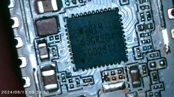 Close-up of a Chip on a Circuit Board Close-up of a chip on a circuit board with visible markings W701M, 06GR2G4, G028T2.