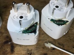 Two damaged BLOW smart sockets with exposed interiors.