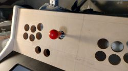 Arcade Game Control Panel with Wooden Frame Arcade game control panel with a wooden frame and a red joystick knob
